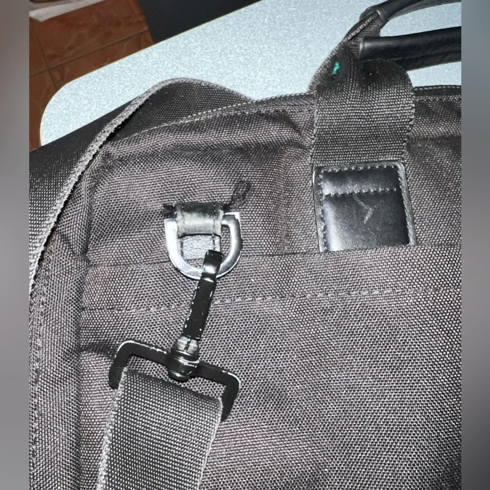 KNOMO Black Unisex Laptop Briefcase Messenger Bag with many compartments.